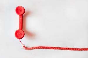 this shows red phone to call courier service